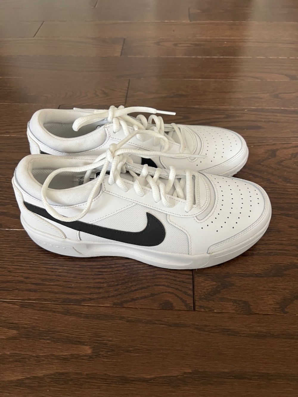 Nike White Low-Top Sneakers with Black Swoosh Accent